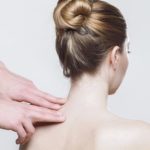 woman getting massage on shoulder