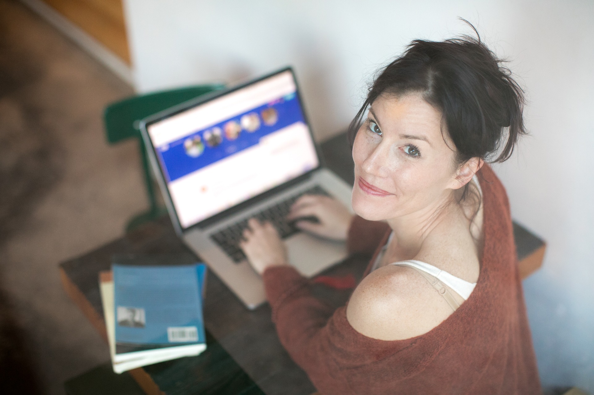 smiling woman typing